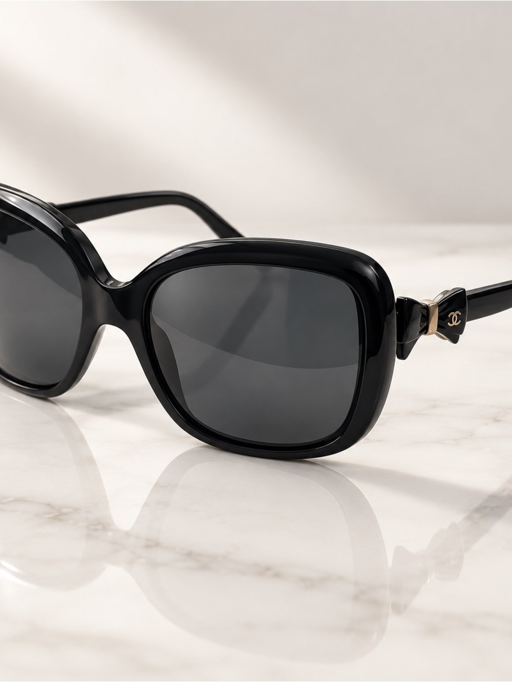 CHANEL Black Sunglasses with Gold CC Bow Detail